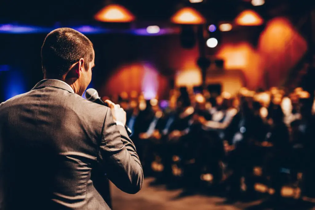 A man speaking to a group of people